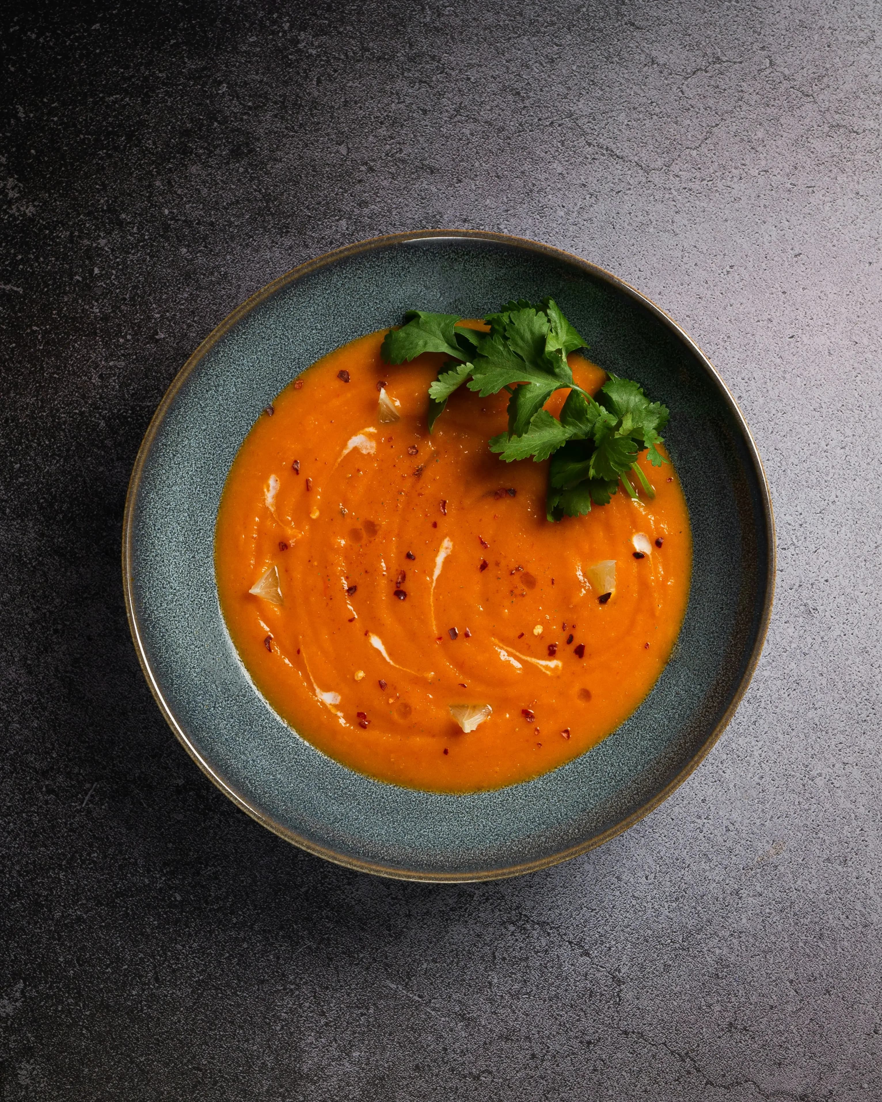 Bowl of orange roasted-pepper soup